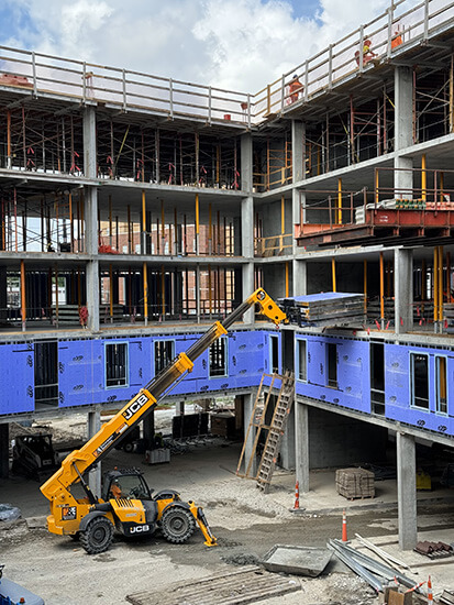 Fully prefabricated wall panels delivered, ready for installation.