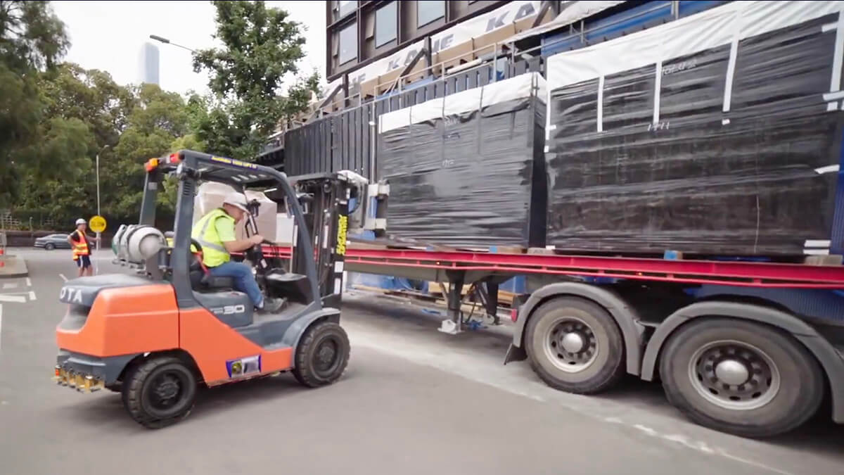 sync industries unloading truck with fork lift